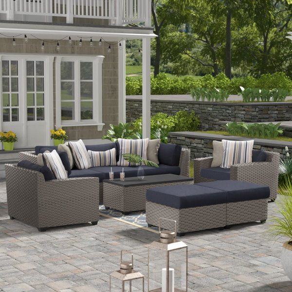 Amjad 8 Piece Outdoor Sectional Seating Group with Cushions